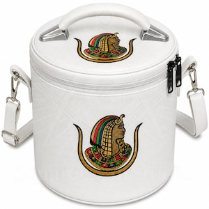 May include: White cylindrical handbag with a top handle and a detachable shoulder strap. The bag features an embroidered design of an Egyptian pharaoh with a colourful headdress. The bag has silver-toned hardware and a zip closure.