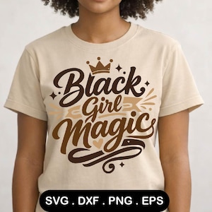 May include: A beige t-shirt featuring the phrase "Black Girl Magic" in brown and tan script with a crown and star accents. The shirt is a crew neck and has short sleeves. The bottom of the shirt has the file types: SVG, DXF, PNG, and EPS.