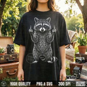 Woman standing outdoors wearing a dark grey t-shirt featuring a white vintage halftone sassy raccoon graphic