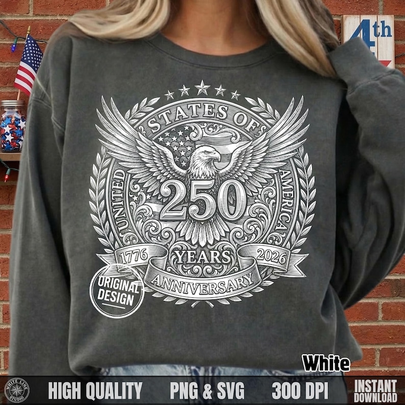 Woman wearing a dark grey sweatshirt featuring a white vintage halftone United States of America 250 years anniversary bald eagle design.