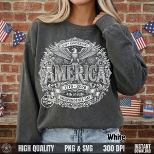 Woman wearing a dark grey sweatshirt featuring a white vintage halftone America 250th anniversary bald eagle design.