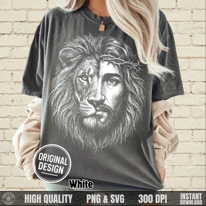 May include: Dark gray t-shirt featuring a split design: one half a lion's face, the other half a depiction of Jesus wearing a crown of thorns. The shirt includes the text "ORIGINAL DESIGN" in a white circle, and "White" below the design.