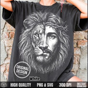 May include: Black t-shirt featuring a detailed white graphic of a lion's face merged with a man's face wearing a crown of thorns. The design includes the text "ORIGINAL DESIGN" and "White". Additional text at the bottom reads "HIGH QUALITY PNG & SVG 300 DPI INSTANT DOWNLOAD".