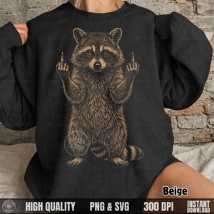 Woman wearing a black sweatshirt with a beige hand-drawn style sarcastic raccoon graphic