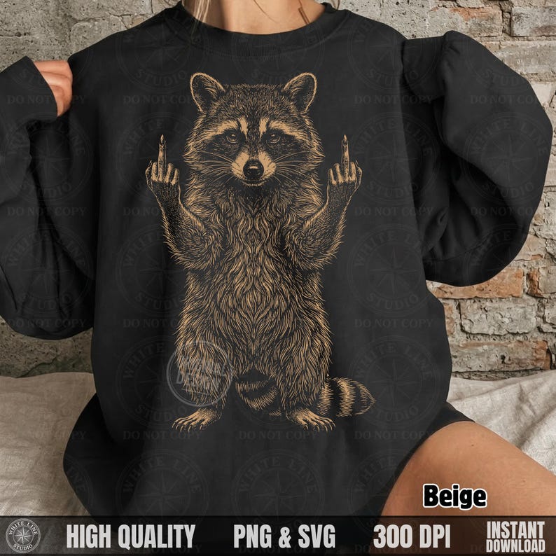 Woman wearing a black sweatshirt with a beige hand-drawn style sarcastic raccoon graphic