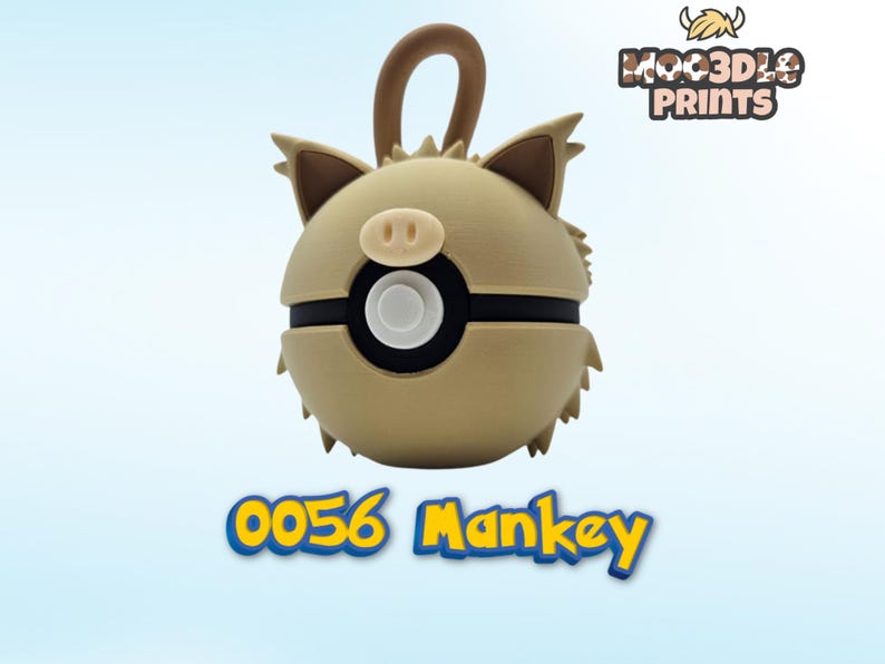 May include: A tan and brown 3D-printed keychain featuring a cartoon character with a pig-like nose and ears. The keychain has a black band around the middle and a loop at the top. The text "0056 Mankey" is displayed below.