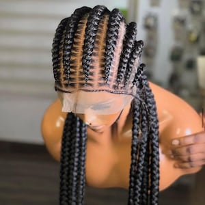 May include: A black braided wig with a lace front, styled on a mannequin. The braids are tightly woven, with a neat, symmetrical pattern across the top of the head. Long, thick braids cascade down the sides, creating a full, textured look.