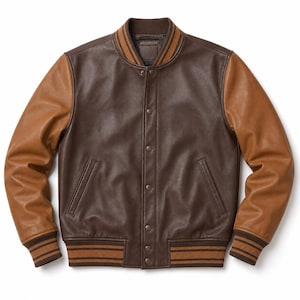May include: A brown leather varsity jacket with tan sleeves. The jacket features a button-up front, two front pockets, and ribbed cuffs and collar with brown and tan stripes. The jacket is a classic style.