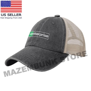 May include: A charcoal gray baseball cap with a mesh back and a curved brim. The cap features the word "enterprise" in a white rectangle with a green accent. The hat is a casual accessory.