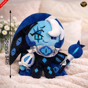 May include: A white ceramic mug with a black handle and the text "But First, Coffee" in a black, handwritten-style font. The mug is on a white surface.