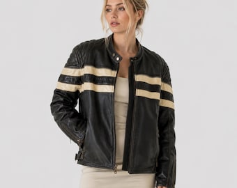 May include: A black leather jacket featuring a stand-up collar with a snap button closure and two horizontal cream-colored stripes across the chest and sleeves. The jacket has a front zipper closure and adjustable side buckles at the waist hem.
