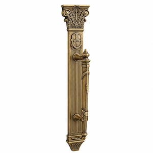 May include: Ornate bronze door handle with a classical column design. The handle features detailed carvings, including floral and shield motifs. The vertical design is approximately 18 inches in length, with a decorative top and base.