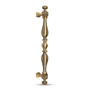 May include: Ornate bronze door pull with a detailed, symmetrical design. The handle features decorative elements and a classic aesthetic. The pull has a vertical orientation and is set against a white background.