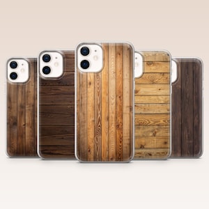 May include: Five phone cases featuring a wooden plank design. The cases display varying shades of brown, from light to dark, with visible wood grain patterns. The cases are made of a clear material.