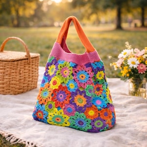 May include: A white ceramic mug with a black handle and the text "But first, coffee" in a black, handwritten-style font. The mug is on a white surface.