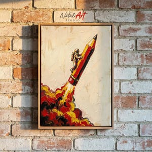 May include: An acrylic painting in a wooden frame depicts an astronaut climbing a pencil rocket blasting off. The pencil is red and yellow, with flames in red, yellow, and orange. The painting is signed "Natali Art Studio".