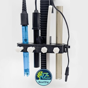 May include: A black plastic probe holder featuring four circular slots with white hexagonal tightening screws. The holder secures a blue sensor, a black sensor, a white tube, and a translucent tube. A ReefZip logo is visible at the bottom.