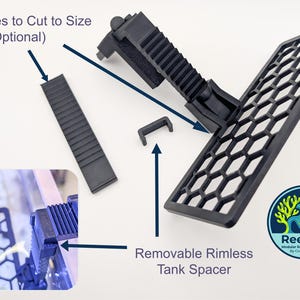 May include: Black modular reef accessories, including a honeycomb-patterned grate, a removable rimless tank spacer, and a ribbed section with score lines for custom sizing. The ReefZip logo is visible.