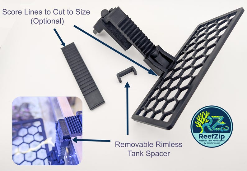 May include: Black modular reef accessories, including a honeycomb-patterned grate, a removable rimless tank spacer, and a ribbed section with score lines for custom sizing. The ReefZip logo is visible.
