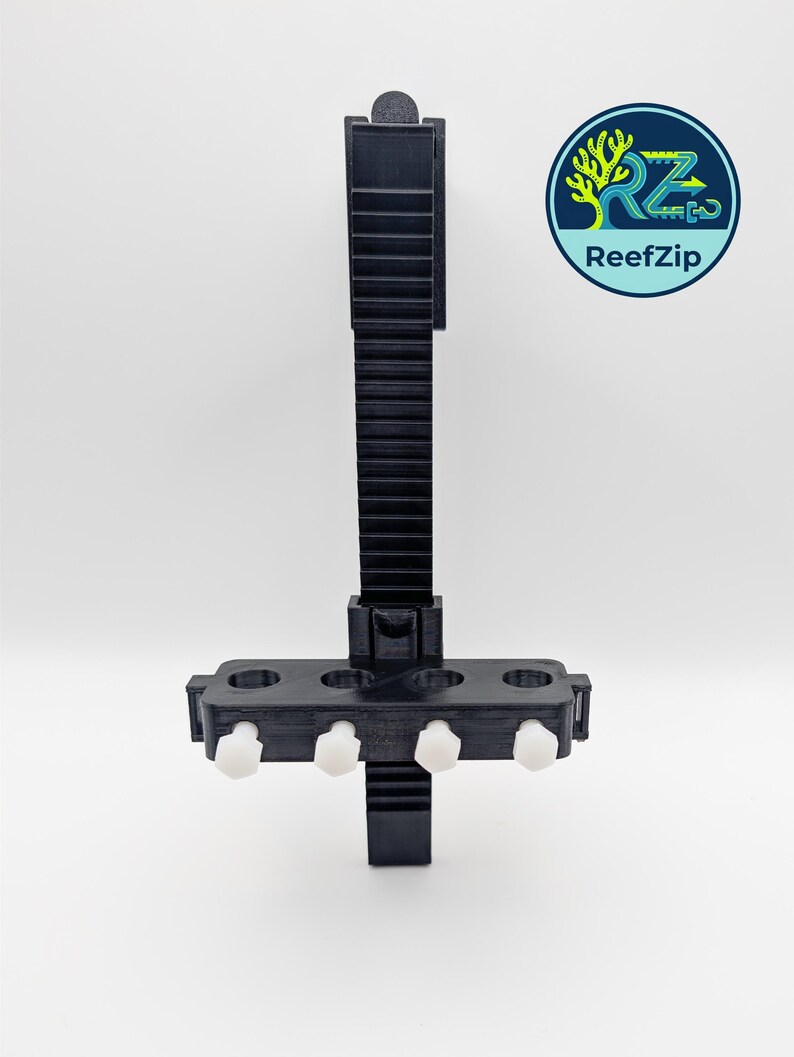 May include: Black 3D-printed aquarium accessory with a vertical, ridged support and a horizontal section holding four white, cylindrical fasteners. The ReefZip logo is in the upper right corner, featuring a tree and the brand name.