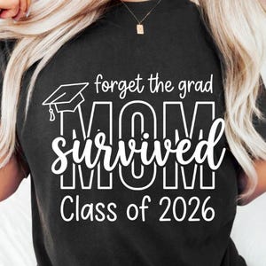 May include: A white ceramic mug with a black handle and the text "But First, Coffee" in a handwritten style. The mug is on a white surface. The mug is approximately 4 inches tall.