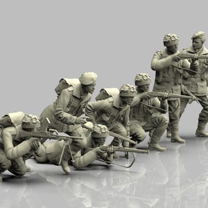 May include: A collection of miniature soldiers in combat positions. Some are kneeling and aiming rifles, others are standing. They are dressed in uniforms and helmets, with backpacks. The figures are a neutral color, possibly a model kit or collectible.