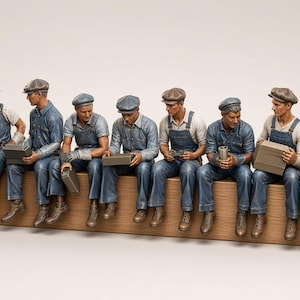 May include: A collection of twelve miniature figurines depicting laborers sitting in a row. Each figure wears blue denim overalls, a light-colored shirt, and a flat cap. The figures are posed holding various small objects, including tools and lunch boxes.