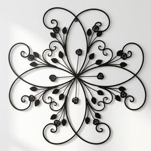 May include: Black metal wall art in a floral design. The artwork features a central starburst with curved lines, leaves, and rose-shaped accents. The piece is mounted on a white wall, creating a striking contrast. This decorative piece is suitable for indoor use.