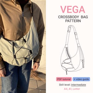 May include: A light green crossbody bag with black drawstrings and a long strap. The bag is worn over the shoulder. The image also includes a diagram of the bag and text that reads "VEGA CROSSBODY BAG PATTERN".