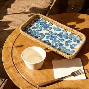 May include: A set of three ceramic mugs with a speckled, matte finish. The mugs are in shades of cream, light gray, and dark gray. Each mug has a simple, minimalist design, perfect for coffee or tea.