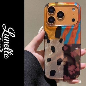 Könnte beinhalten: Ein Set aus drei Keramikbechern mit gesprenkelter, matter Oberfläche. Die Becher sind in Creme-, Hellgrau- und Dunkelgrautönen gehalten. Jeder Becher hat ein schlichtes, minimalistisches Design, perfekt für Kaffee oder Tee.