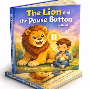 May include: A children's book titled "The Lion and the Pause Button" by Dr. Ali. The cover features a friendly lion and a young boy with a glowing light. The book has a blue cover with yellow text and illustrations.