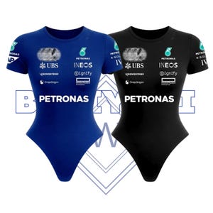 May include: A white ceramic mug with a black handle and the text "But first, coffee" in a handwritten style. The mug is on a white surface. The mug is approximately 4 inches tall.