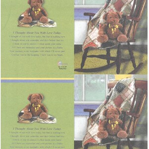 May include: A brown teddy bear with a yellow ribbon sits on a patterned blanket. The image includes text that reads "I Thought About You With Love Today." A rocking chair and a quilt are also visible.