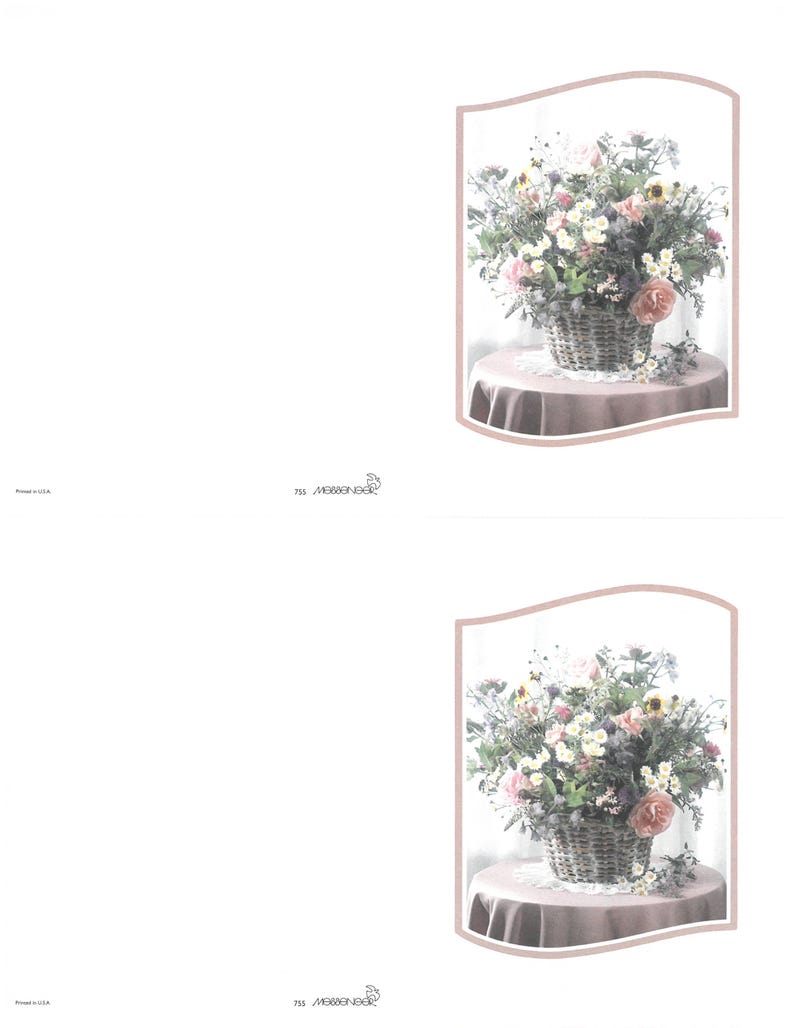 May include: A floral display in a wicker basket, with pink, white, and yellow blooms. The basket rests on a small, round table covered with a pink cloth. The image is framed with a soft pink border.