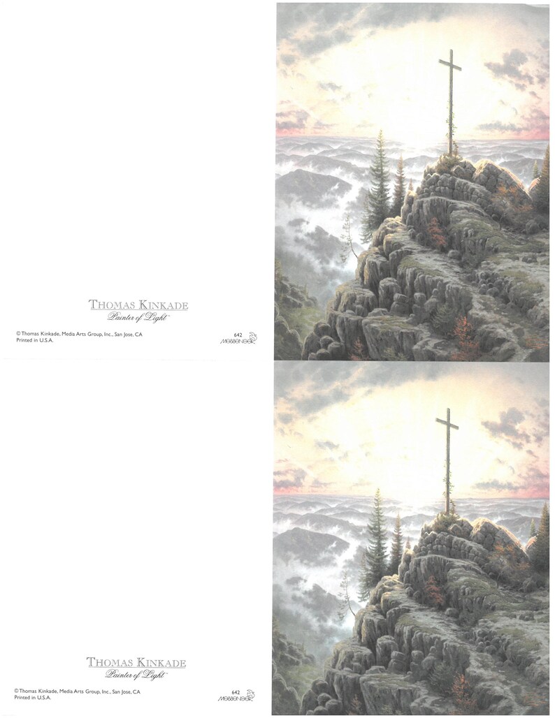 May include: A landscape print depicting a cross on a rocky mountain, set against a sunrise or sunset. The artwork is signed "THOMAS KINKADE Painter of Light". The print is a religious themed artwork.