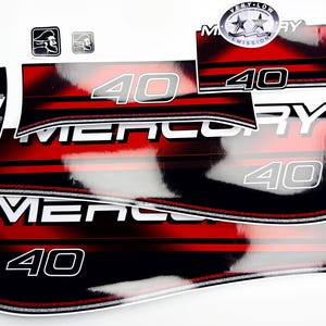 May include: A set of Mercury 40 outboard motor decals featuring a black and red gradient design with white lettering. The decals include the Mercury brand name, the number 40, a Very Low Emission badge, and small gear shift indicator labels.