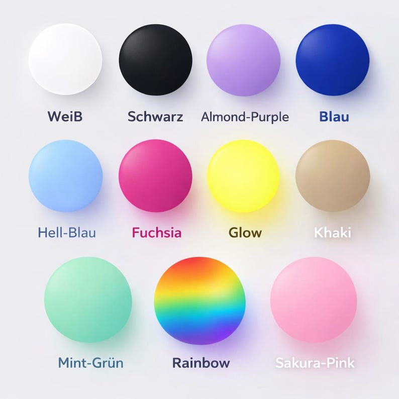 May include: A collection of twelve round objects in various colors, including white, black, purple, blue, light blue, fuchsia, yellow, beige, mint green, rainbow, and pink. Each object has a corresponding color name written below it.