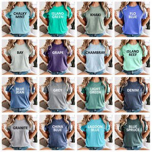 May include: A collection of short-sleeved t-shirts in various colors, each with a different color name printed in white. Colors include Chalky Mint, Island Green, Khaki, Flo Blue, Bay, Grape, Chambray, Island Reef, Blue Jean, Grey, Light Green, Denim, Granite, China Blue, Lagoon Blue, and Blue Spruce.