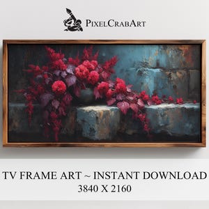 May include: A framed digital art print featuring a floral arrangement with vibrant red blooms and deep burgundy leaves. The artwork is set against a backdrop of textured blue and gray tones, creating a striking contrast. The frame is a warm brown color. The text "TV FRAME ART ~ INSTANT DOWNLOAD" is visible.