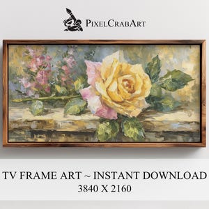 May include: A framed floral oil painting featuring a large yellow and pink rose with green leaves. The artwork is set against a backdrop of soft pink flowers and a textured, wooden-like surface. The frame is a dark brown color. The text "TV FRAME ART ~ INSTANT DOWNLOAD" is at the bottom.