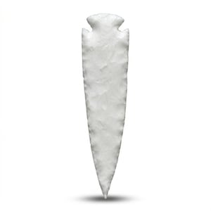 May include: A white, hand-knapped arrowhead with a triangular shape and a notched base. The stone tool has a textured surface and a sharp point, likely used for hunting or warfare. The arrowhead is isolated on a white background.