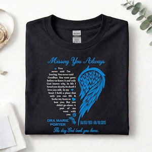 May include: Black t-shirt with the text "Missing You Always" in blue script. A blue wing design is on the right side. The shirt includes a poem and the name Ora Marie Porter with dates 04/03/1931-06/18/2015.