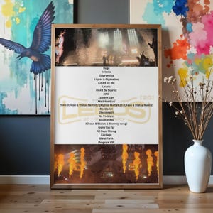 May include: A framed poster featuring a concert photograph at the top and bottom with a white centre panel listing song titles including Rage, Selecta, Disgruntled, Liquor & Cigarettes, Count on Me, Levels, Don't Be Scared, NRG, Eastern Jam, and more.
