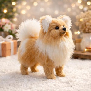 May include: A handmade Pomeranian dog plush toy. The toy has a fluffy, two-tone coat in shades of tan and white, with a matching fluffy tail and ears. The dog is standing on a white, textured surface, giving it a soft, inviting appearance.