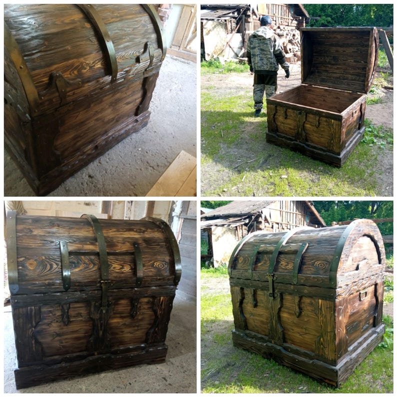 Puede incluir: Un cofre de madera r&uacute;stico de color marr&oacute;n oscuro con tapa abovedada y detalles met&aacute;licos. El cofre est&aacute; asegurado con bandas met&aacute;licas y herrajes decorativos. La veta de la madera es visible. El cofre es rectangular y tiene una base.