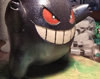 Pokémon holographique fenêtre Gengar avec yeux et dents phosphorescents