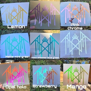 May include: A collection of nine vinyl decals featuring a geometric crown-like logo in various finishes including lemon yellow, glittery purple, pink chrome, matte mint green, holographic blue-green, opal holo, strawberry, and mango.