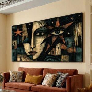 May include: A rectangular wall art piece featuring a stylized face with large eyes, dark hair, and a star-filled night sky background. The composition incorporates geometric shapes, architectural silhouettes, and a color palette of gold, black, and blue.