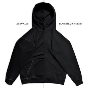 May include: Black hoodie with a kangaroo pocket and drawstring hood. The left side features an acid wash effect, while the right side is plain. The text "ACID WASH" and "PLAIN/HEAVYWEIGHT" are printed on the image.